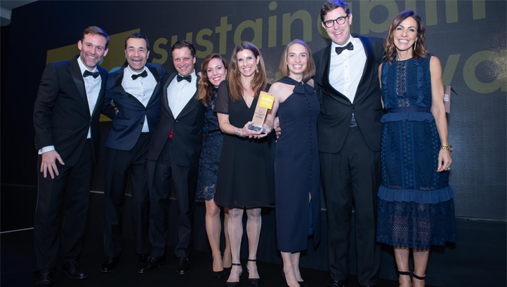 Global Action Plan's Chris Large (left) and compere Julia Bradbury presenting the Barry Callebaut team with the award